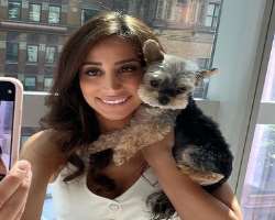 Danielle is an animal lover and cuddles them to show her love. 